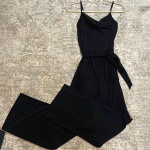 Bebe black flare leg jumpsuit size small, never worn